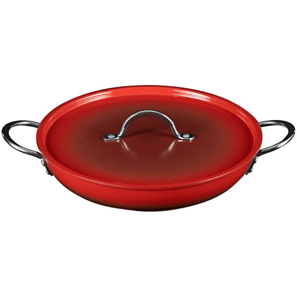 A Bon Chef ombre crimson red saute pan with a lid and handle.