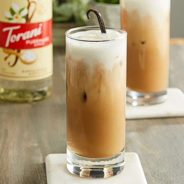 A glass of iced coffee with Torani Puremade Vanilla Salt Flavoring Syrup in it.