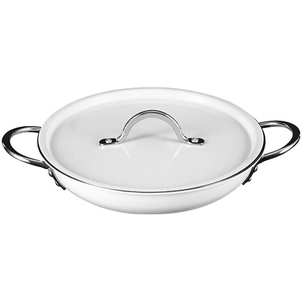 A white saute pan with a metal handle and lid.