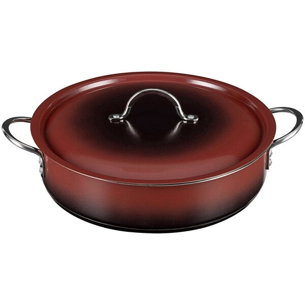 A red round Bon Chef brazier with a handle and lid.