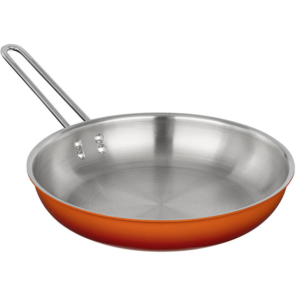 A close-up of a large orange Bon Chef Country French skillet.
