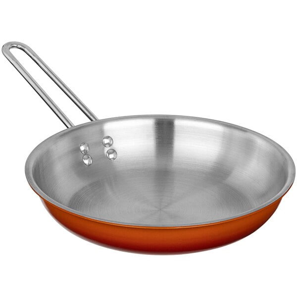 A Bon Chef stainless steel frying pan with an ombre tangerine finish.