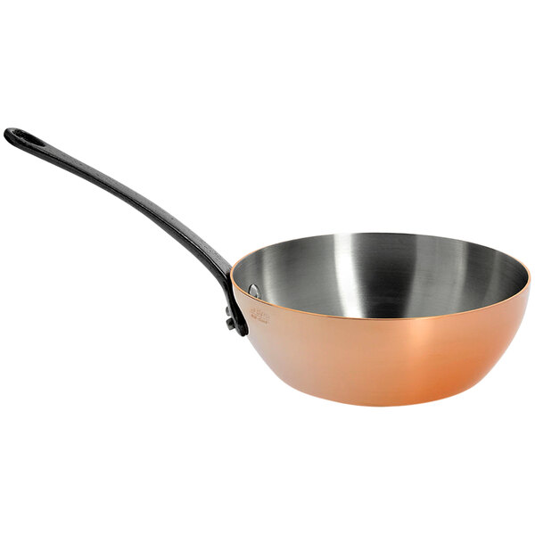 A de Buyer copper conical pan with a handle.