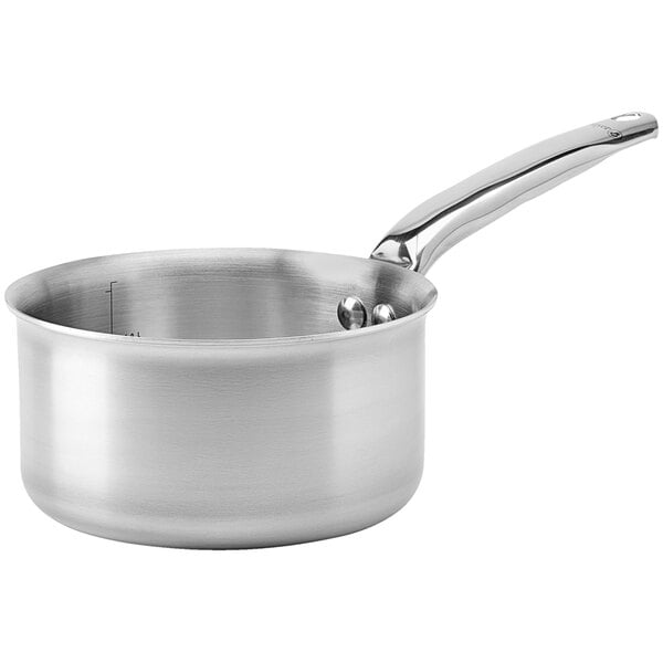 A close-up of a silver de Buyer Alchimy stainless steel saucepan with a handle.