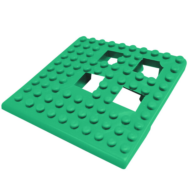 A green square corner piece with holes in it.