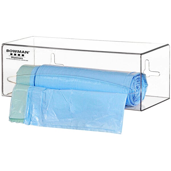 A clear plastic container holding a roll of clear plastic bags.
