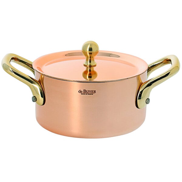 A de Buyer copper sauce pot with a lid.