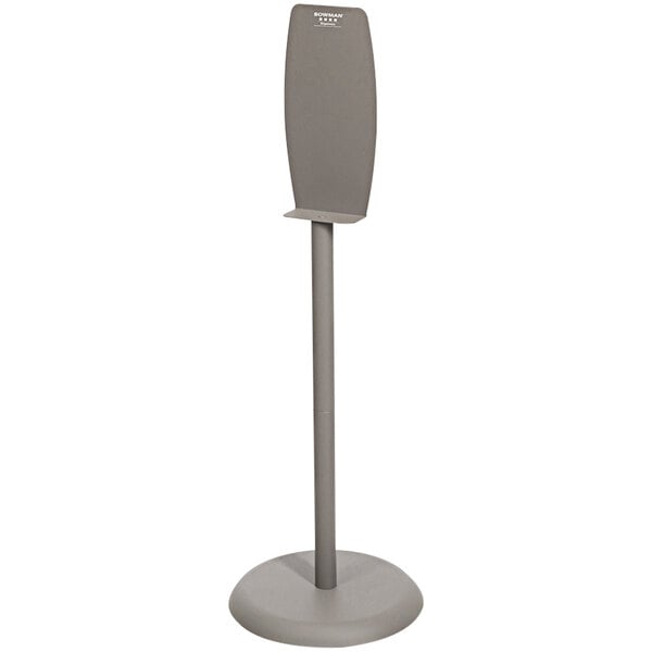 A gray powder-coated steel floor stand with a rectangular white object on it.