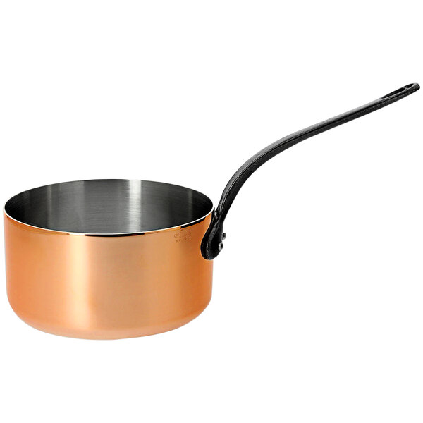 A de Buyer copper sauce pan with a handle.