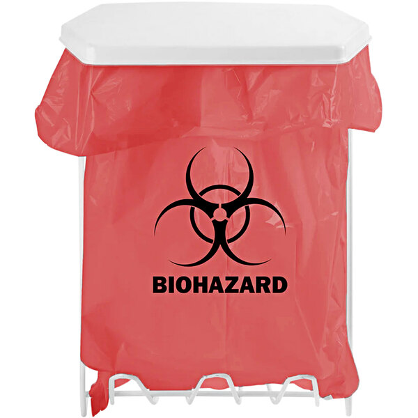 A BOWMAN white coated wire biohazard bag holder with a red biohazard bag and black biohazard symbol on it.