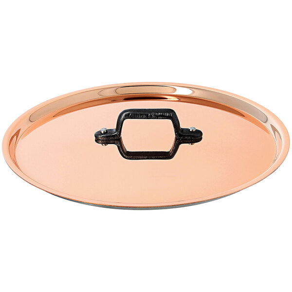 A de Buyer copper lid with a handle.
