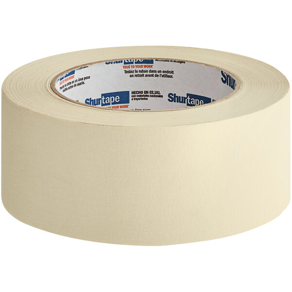 A roll of tape with blue and white text that reads "Shurtape Natural Contractor Grade Masking Tape"