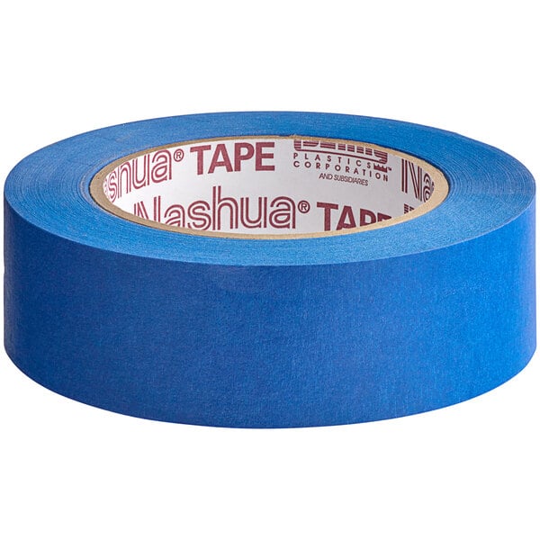 A roll of blue Nashua masking tape on a white surface.