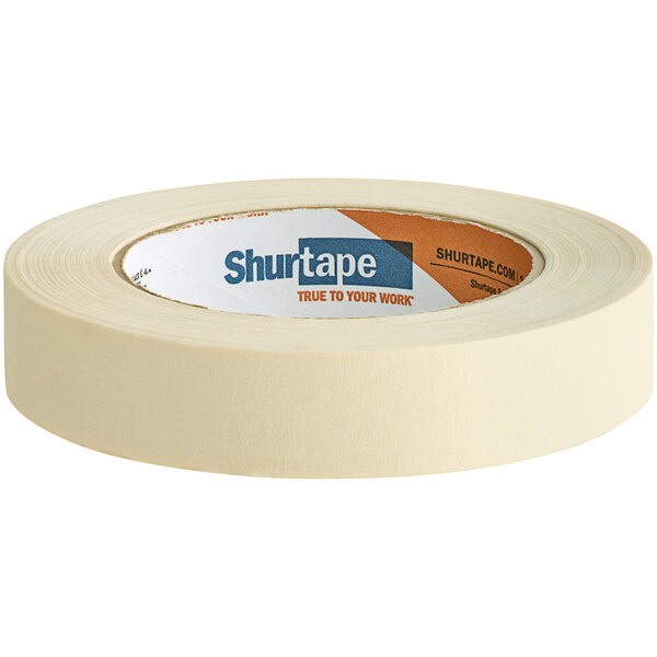 A roll of Shurtape natural utility grade masking tape with orange and white packaging.