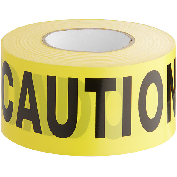 A roll of yellow Shurtape caution tape with black text.