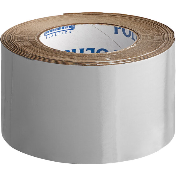 A roll of silver Nashua plain foil tape with brown paper on it.