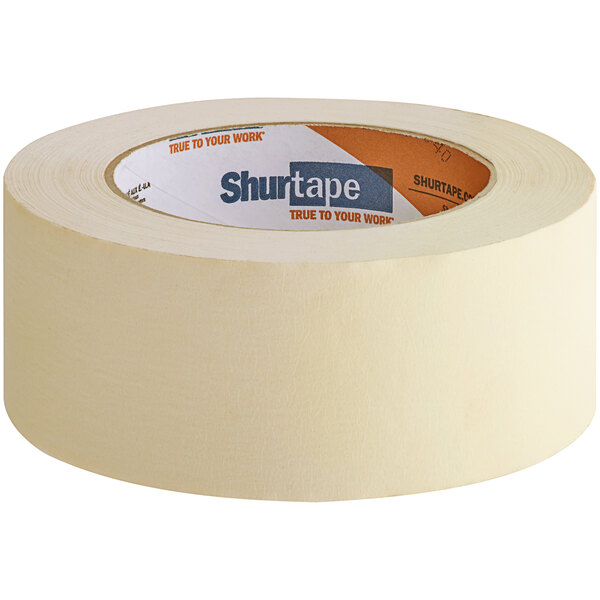 A roll of Shurtape natural utility grade masking tape with a label.