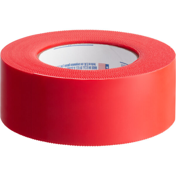 A roll of red Nashua Polyethylene Film Tape with white writing on it.