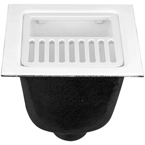 A black and white Zurn floor sink with a grate over the drain.