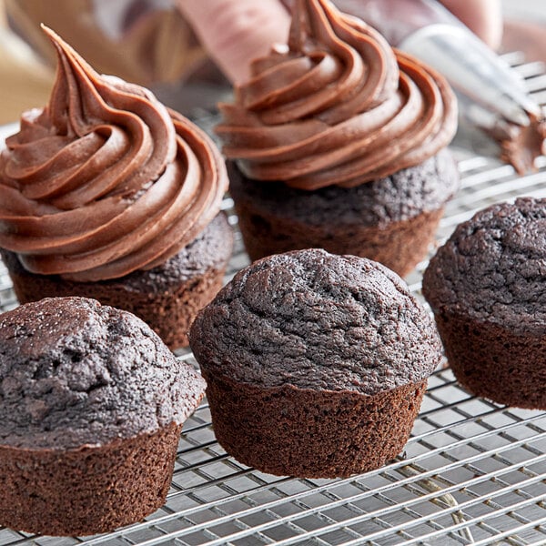 Chocolate cupcakes made with Pillsbury Bakers' Plus Devil's Food Cake Mix on a cooling rack.