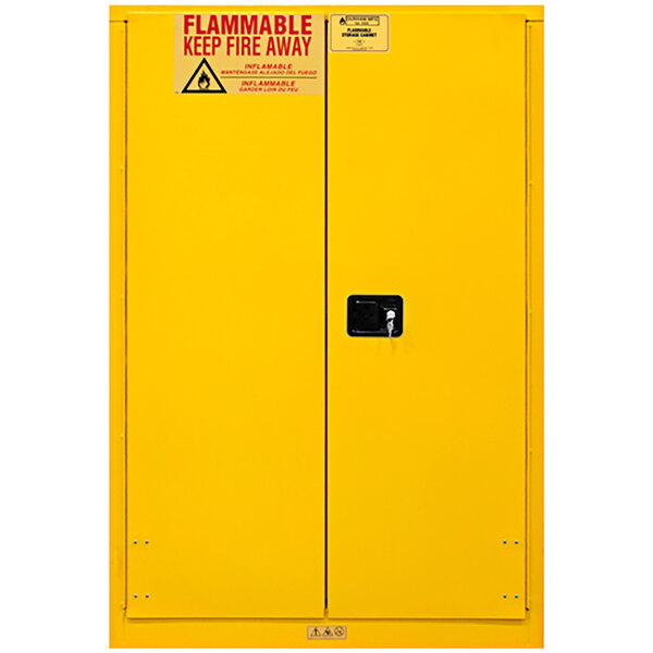 A yellow Durham Mfg safety cabinet with a warning sign.