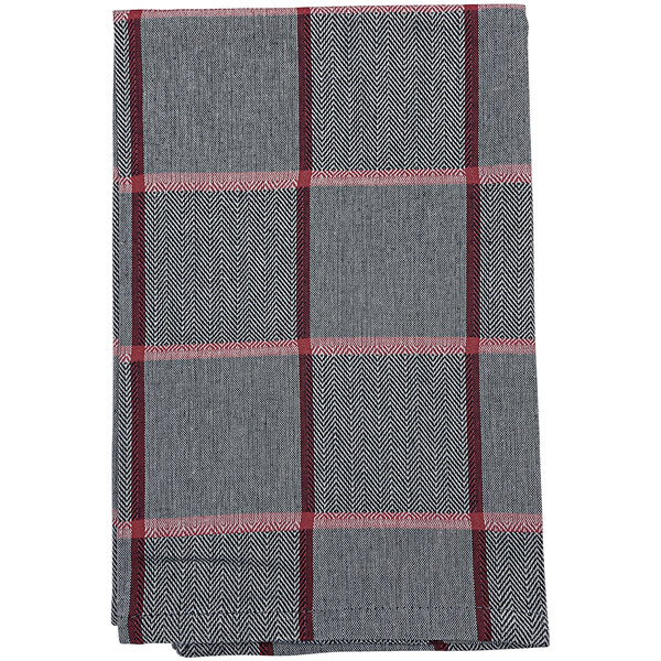 A folded Garnier-Thiebaut Quadramuri cloth napkin with a gray and red plaid design.