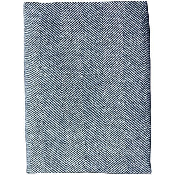A close up of blue and white striped Garnier-Thiebaut Chevroni cloth napkins with a white border.