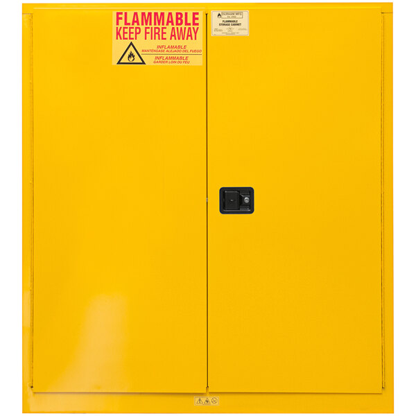 A yellow Durham Mfg safety cabinet with a sign reading "Flammable Storage" in red and black.