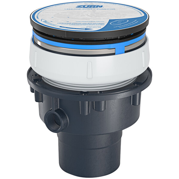 A Zurn PVC floor drain with a round blue and black lid.