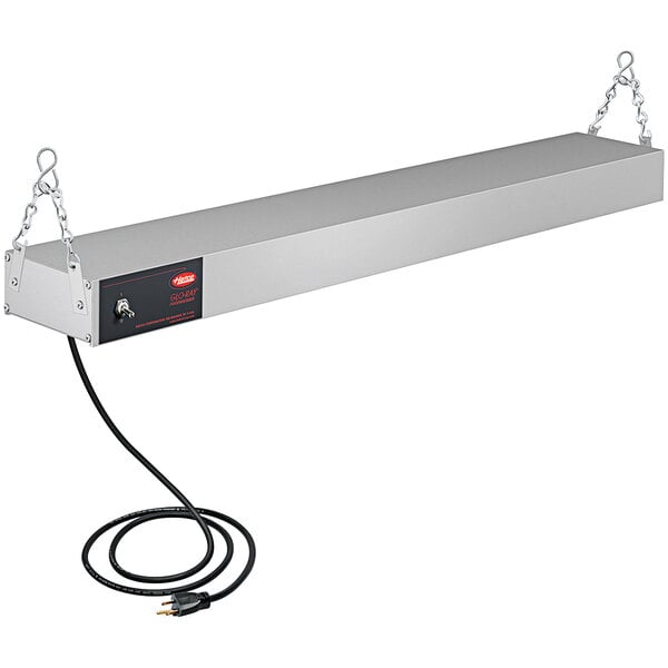 A rectangular metal Hatco infrared food warmer with a cord attached to it.