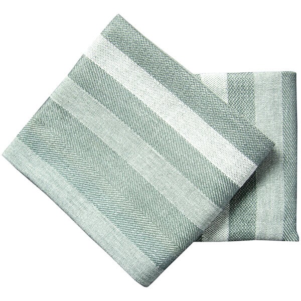 A folded green and white striped Garnier-Thiebaut Brazos cloth napkin.