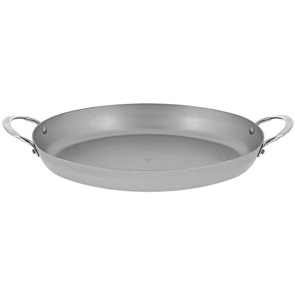 A de Buyer oval carbon steel roasting pan with handles.