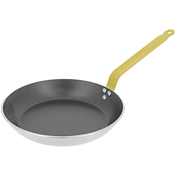 A de Buyer aluminum non-stick frying pan with a yellow handle.