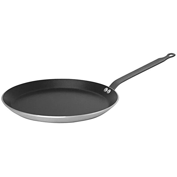A black and silver de Buyer Choc Resto Induction crepe pan with a handle.
