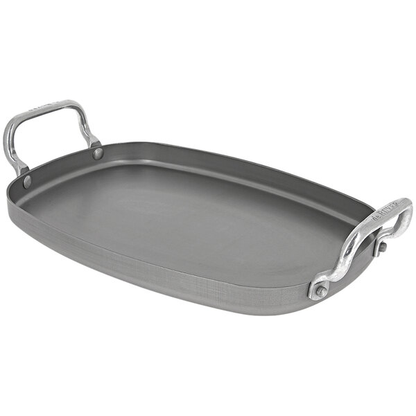 A rectangular carbon steel de Buyer roasting pan with handles.