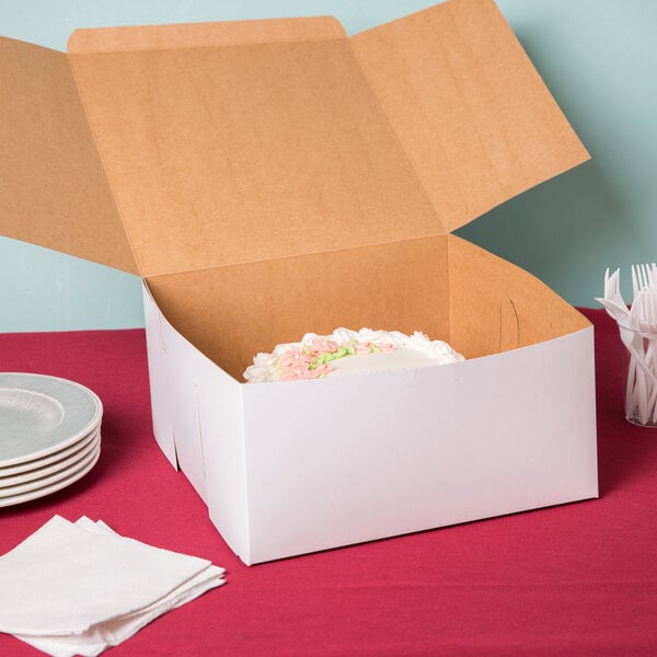 A white customizable cake box with a cake inside.