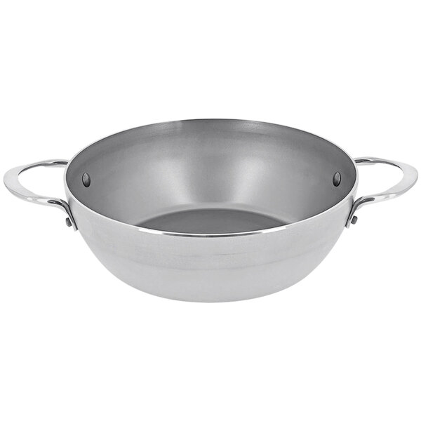 A silver de Buyer carbon steel fry pan with dual handles.