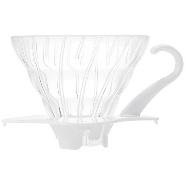 A white glass coffee dripper with a white handle.