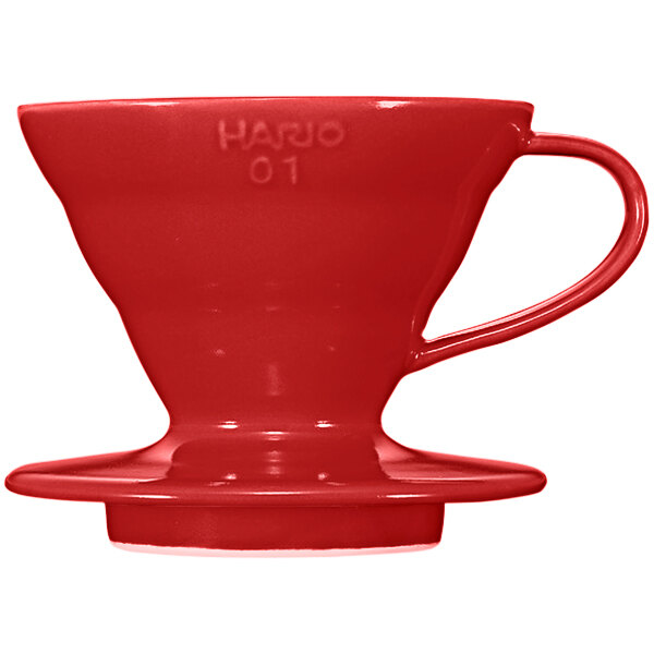 A red Hario V60 ceramic coffee dripper with a handle.