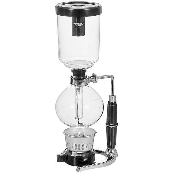 A Hario coffee syphon on a glass and metal stand.