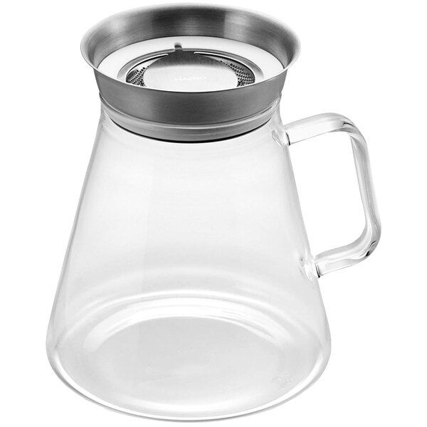 A Hario glass tea server with a stainless steel filter.