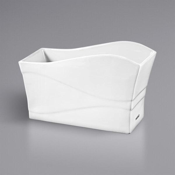 A white rectangular container with curved edges and a handle.