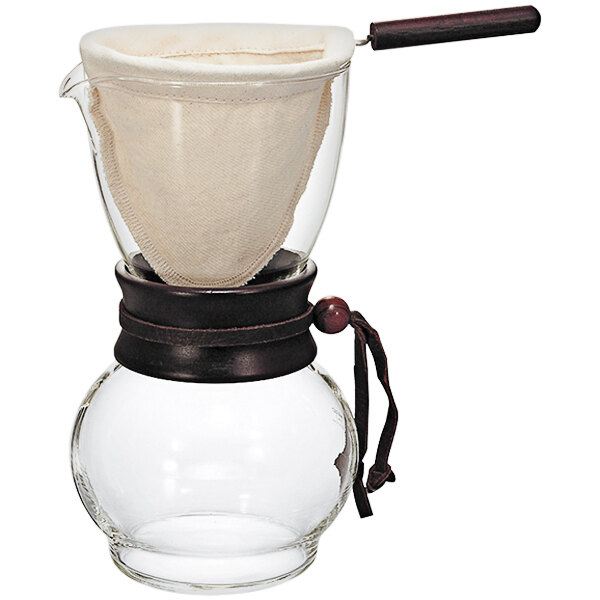A glass coffee maker with a wooden neck and a cloth filter.