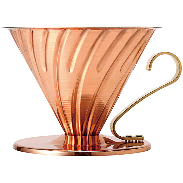 A copper Hario V60 coffee dripper with a handle.