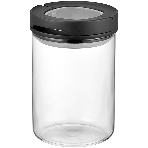A clear Hario glass canister with a black lid.