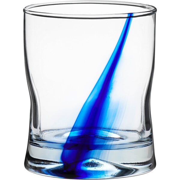 A Libbey double old fashioned glass with a blue swirl on it.