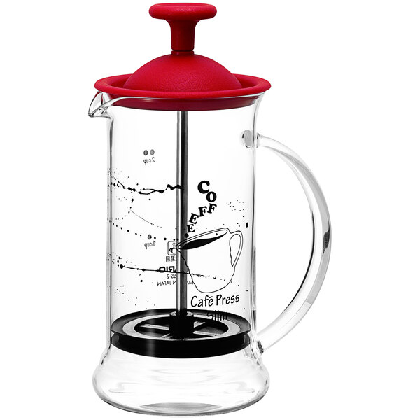 A Hario glass coffee press with a red lid and black handle.