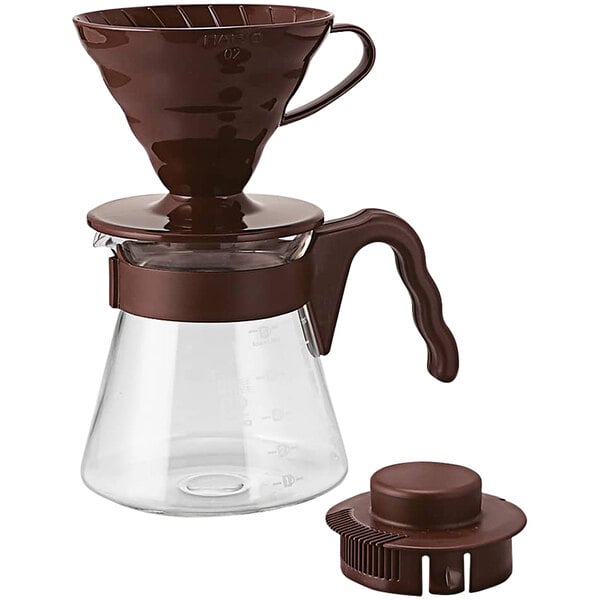 A Hario V60 brown plastic coffee maker with a glass pot and brown lid.