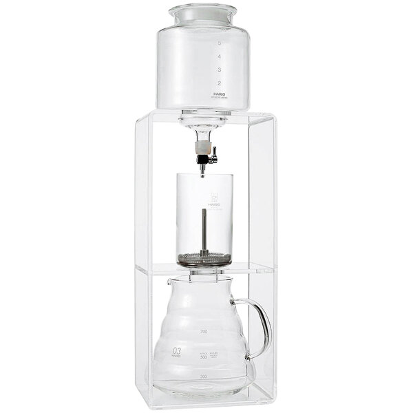 A clear glass Hario cold brew coffee maker with a glass top.