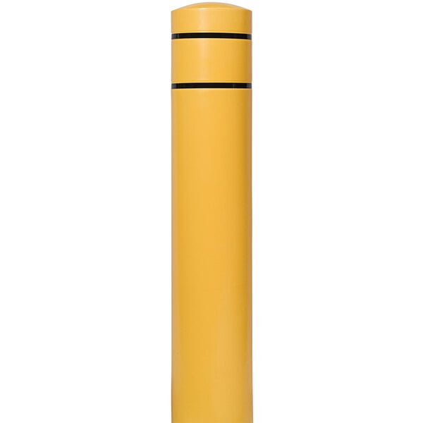 A yellow cylindrical object with black stripes.